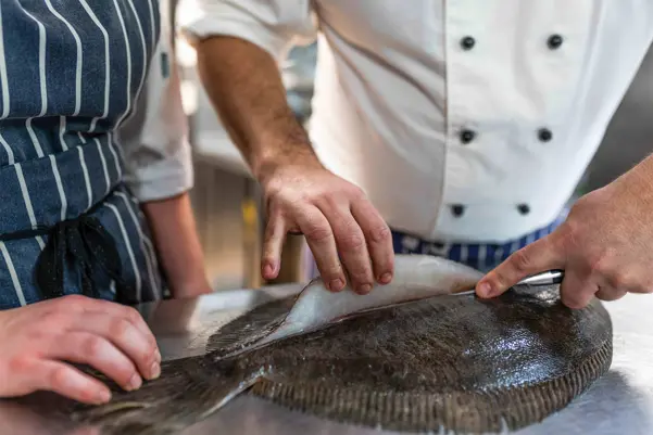 Chef slicing fish